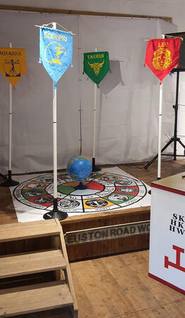 Zodiac banners and a globe arranged for a ceremonial presentation Zodiac banners and a globe arranged for a ceremonial presentation