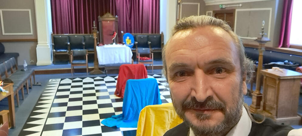 Andrew T. Austin inside a ceremonial lodge with a chequered floor Andrew T. Austin inside a ceremonial lodge with a chequered floor