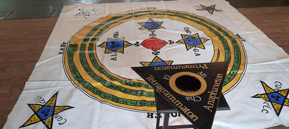 Ceremonial floor cloth and triangular table bearing symbolic names Ceremonial floor cloth and triangular table bearing symbolic names